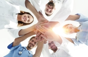 Medical team joining hands