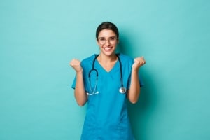 Smiling medical professional against a solid backdrop